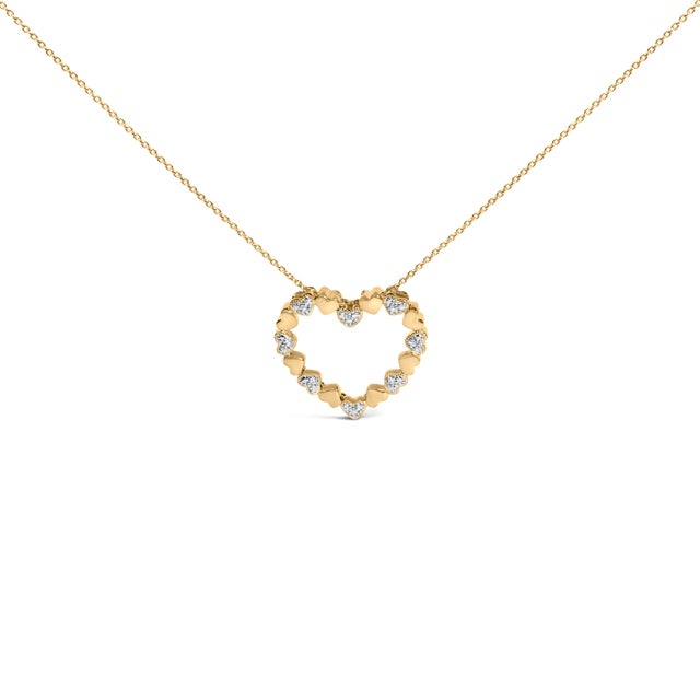 A serenade of devotion circles your neckline: an airy open heart traced by a continuous procession of tiny, rounded puffed...