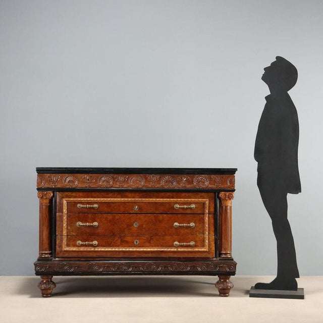Mid-20th century Italian chest of drawers, crafted in walnut and walnut burl with ebonized details. The green serpentine...