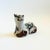 A handmade vintage pottery cat. Pale gray glaze with beautiful hand painted designs in brown, green, and white with some...