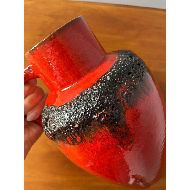 This striking carafe, serial number 223, is an authentic example of renowned West German pottery and was produced by...