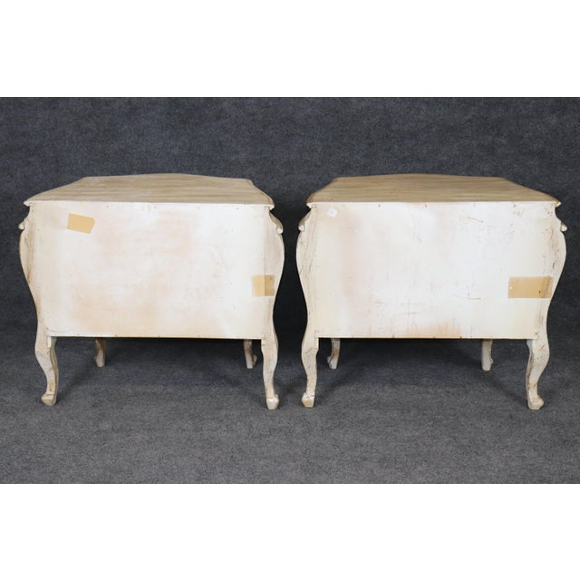 Charming, warm, and effortlessly inviting, this pair of Country French style distressed paint decorated nightstands...