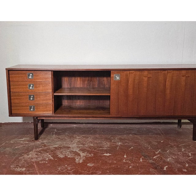 Gorgeous teak sideboard dating back to the mid-1960s, made in Italy by STILDOMUS. Two large sliding doors and four...