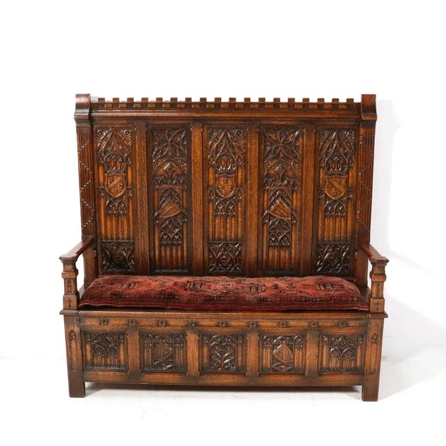 Magnificent and ultra rare Gothic Revival high back hall bench. Striking Dutch design from the 1900s. Solid oak frame with...
