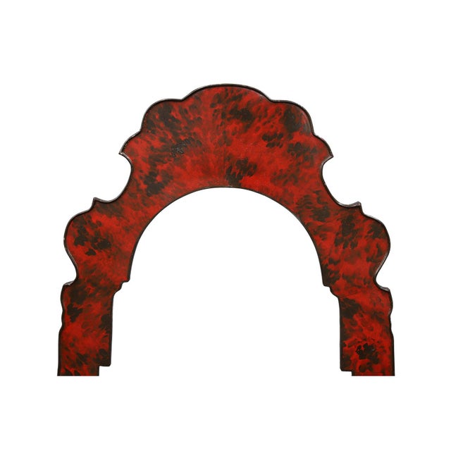 This mirror is finshed in a red faux turtle, with a more ornate top of the frame. Two rings in the back of the mirror...