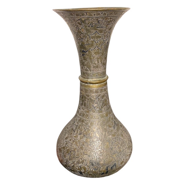 This is an extraordinary Qajar Persian engraved brass vase, dating to the mid- to late 19th century, with stunningly dense...