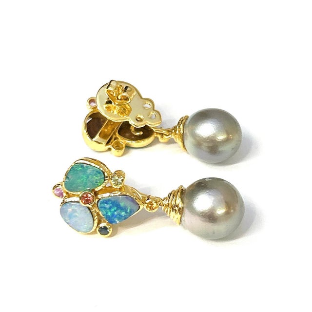 Natural Blue Opal- 4.00 carat Multi color sapphires - 1.50 carat South sea Tahiti silver pearls The earrings from the...