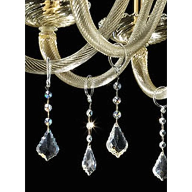 Stunning Venetian modern clear with gold-leaf Murano glass chandelier . Full od culs and crystal pendants in a new linear...