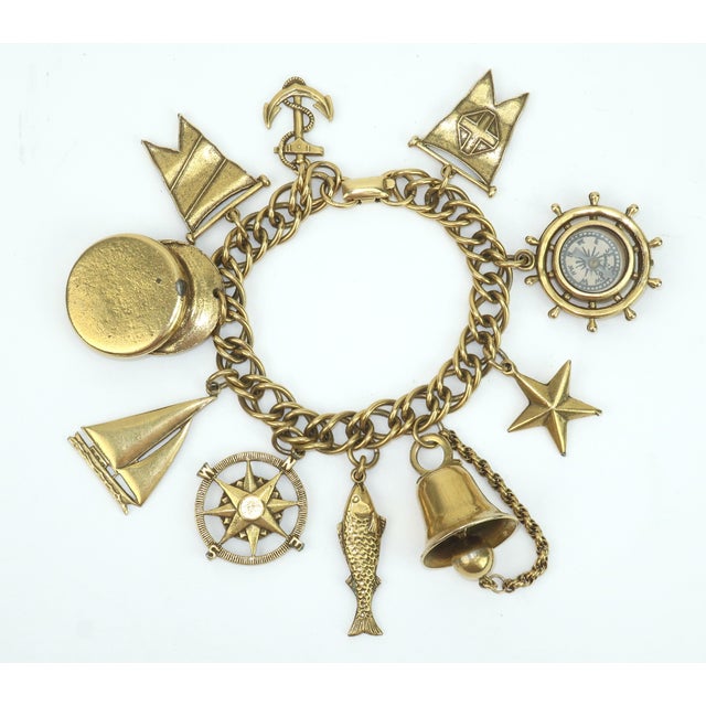 Ahoy! There she blows...a fun gold tone charm bracelet with a nautical theme by Coro. This bracelet dates back to the mid...