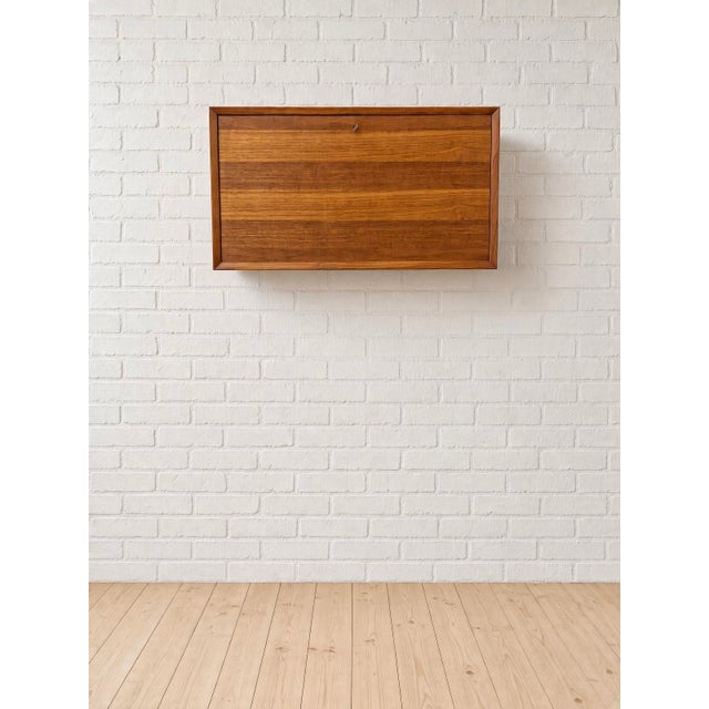 Vintage teak bar cabinet for use in the cado system, designed 1960 by poul cadovius. this cabinet is a fantastic addition...