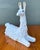This charming vintage llama sculpture is a quintessential example of Hollywood Regency whimsy and sophisticated animalier...