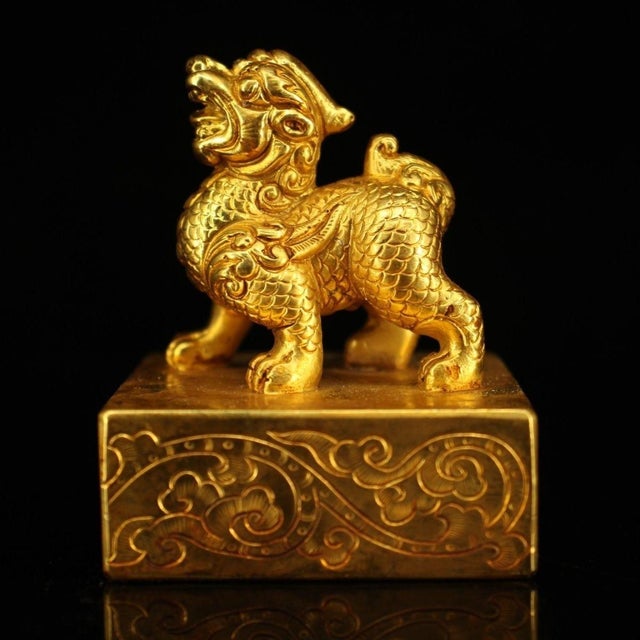 This is a finely crafted antique gilt bronze seal stamp, featuring a detailed sculpture of a Qilin (a mythical hooved...