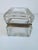 A 19th century glass crystal and brass jewelry box from France. It has a handsome linear cut pattern along the borders....