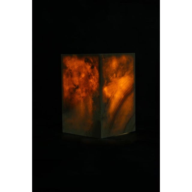 A sculptural side table pedestal carved from natural onyx, handcrafted by skilled artisans on the island of java. Its...