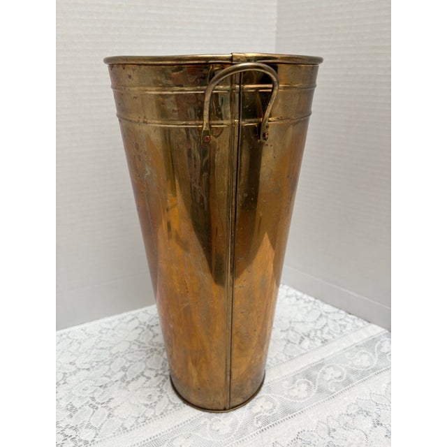 Vintage solid brass wastebasket or umbrella holder with two side handles. Solid and substantial feeling in weight and...