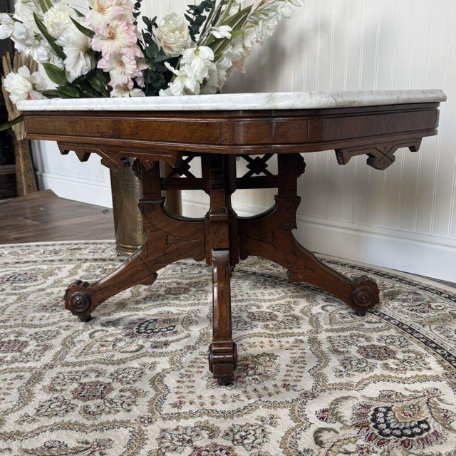This exquisite Victorian marble-top parlor table dates to the mid-to-late 19th century (circa 1860–1880) and beautifully...