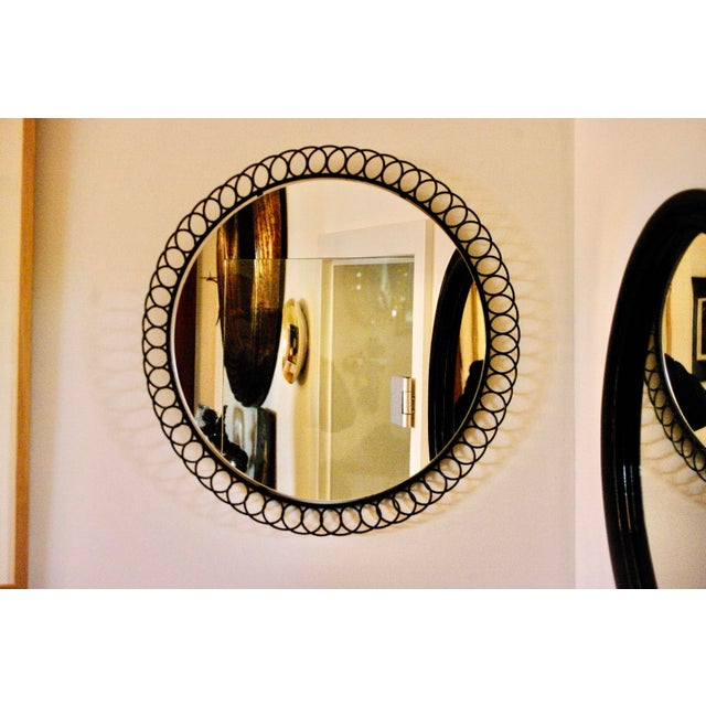 Large Circular String Mirror in Lacquered Metal, 1960, in Very Good conditions. Designed 1960 to 1969 This piece is...