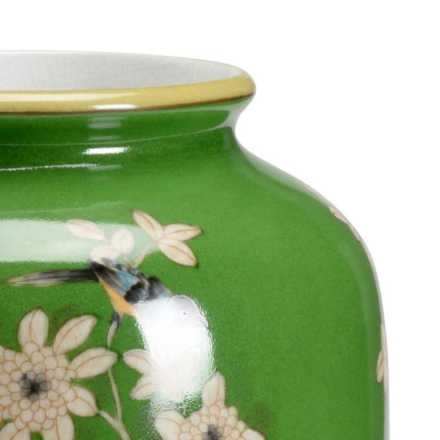 Green glaze on ceramic with hand painted floral and birds. (Vase opening: 4"w) 14h x 5w x 5d