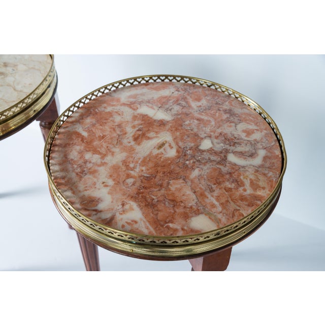 Just is this Pair of French Louis XVI Style Bouillotte Marble Top Small Side Tables. These are what you call in French...