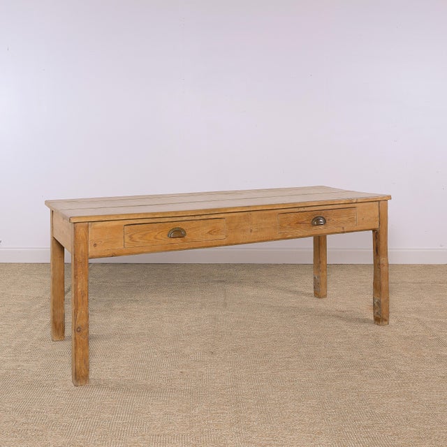 Dimensions: 26.25"D x 75"L x 30"H Skirt: 22"H A wonderfully simple antique pine farmhouse table with a warm, naturally...