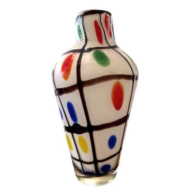 A colorful vintage Italian Murano art glass vase, Attributed to Anzolo Fuga, dating to the mid-20th century, distinguished...