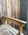 A small antique children's storage bench with a striking original patina: a mustard ochre and white background, pink and...