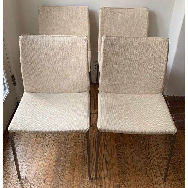 Set a four dining side chairs, solid aluminum frame covered a grass cloth woven ivory fabric