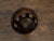 A rustic English turn of the century oak barrel from the early 20th century with six brass braces and open accents, made...