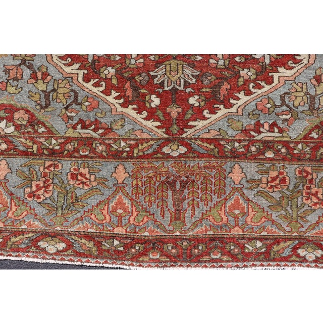 Early 20th Century Antique Persian Bakhtiari Rug With Red Field and Blue Medallion Design For Sale - Image 5 of 16