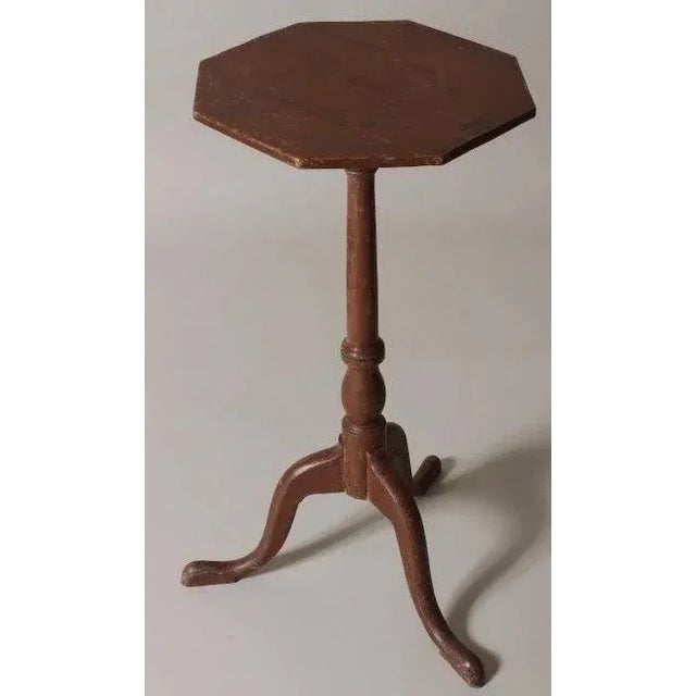 Antique red painted American Federal candle stand with turned baluster pedestal support rising above snake feet. Elegant...