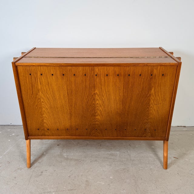 This vintage blanket chest was designed by Frantisek Jirak and produced by Tatra Nabytok in the former Czechoslovakia. The...