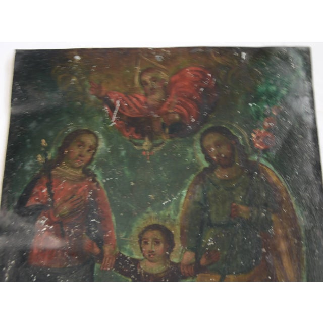This is a stunning Mexican folk art retablo dating to the late 19th century. This retablo features oil paint on a sheet of...