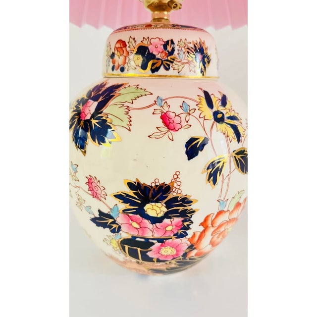An early 20th century round table lamp made from a highly detailed ironstone Mason’s jar. Chinese inspired design,...
