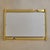 A sculptural Italian wall mirror by Luciano Frigerio, 1970s. The polished brass frame is shaped with twisted ribbon-like...