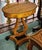 Bring a distinctive touch of European elegance to your interior with this French Empire-inspired side table, featuring a...