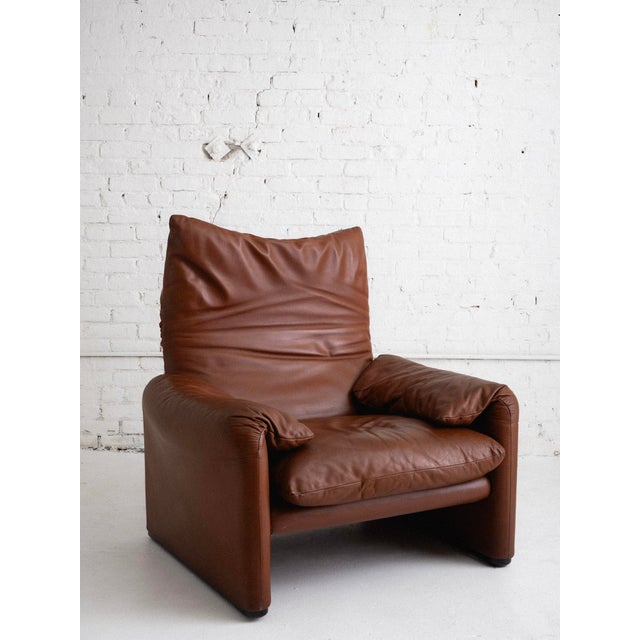 A “Maralunga” lounge chair by Vico Magistretti for Cassina. Original caramel leather upholstery. Sourced in Northern...