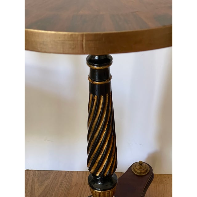 Elegant Neoclassical revival side table with beautiful inlayed top, ebonised base with bronze finials.