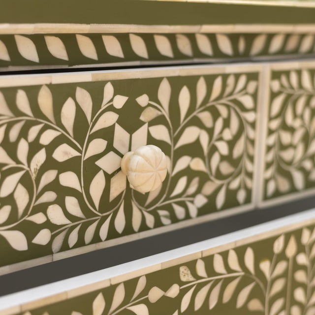 The Arabesque Olive Green Bone Inlay Dresser & Changing Table explores traditional botanical ornamentation through an...