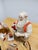 An impressive depiction of Santa's workshop, featuring the workbench, the gift list book, and the toys—all beautifully...