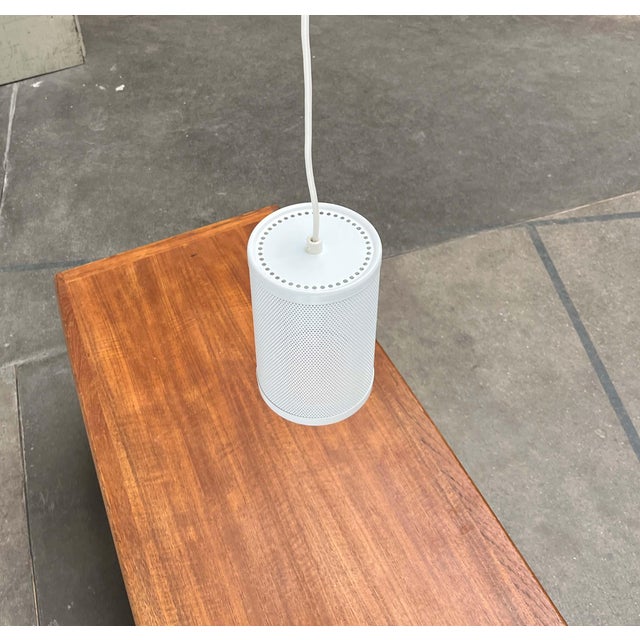 Pendant lamp by the Finnish manufacturer Orno. A minimalist design. The lamp body consists of a simple cylinder. The...