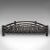 This is an antique demi-lune fire grate. An English, cast iron fireplace basket, dating to the late Victorian period,...