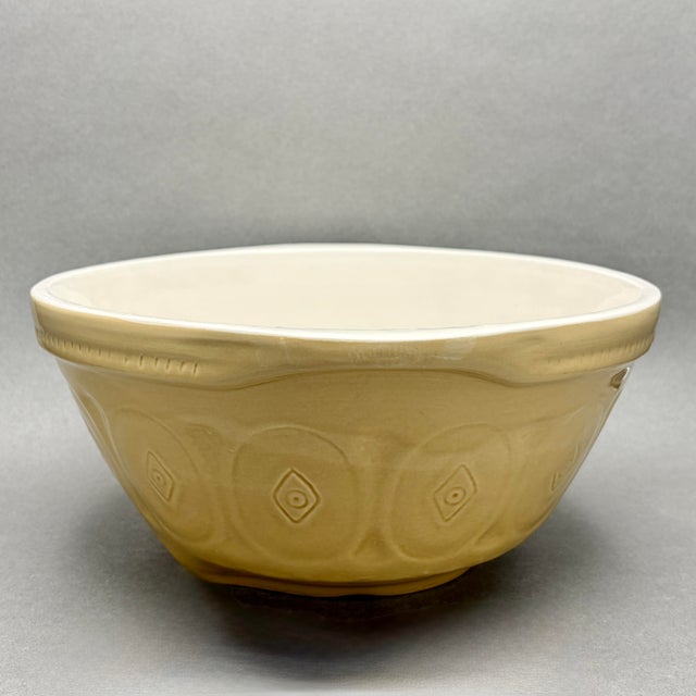 • CPCA (California Pottery), embossed mixing/serving bowl. • Made in the USA, Mid-Century (circa 1940s–1950s). • Glossy...