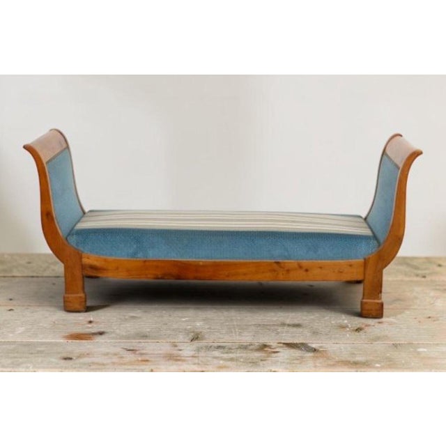 Cherrywood chaise longue/bench with molded detailing. First half of the 19th century. Reupholstered in new fabric....