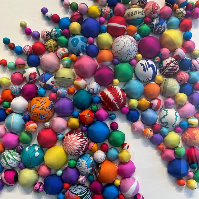 Each pom pom is carefully crafted from up-cycled luxury scarves, hand selected for their exquisite patterns. Most of the...