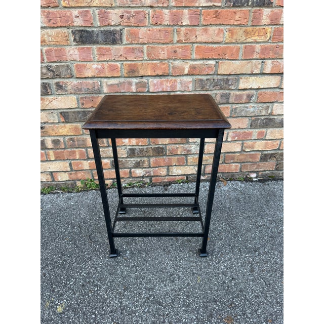 Reclaimed stool tops from a 19th Century English joint stool and remade into a wonderful side table with an iron base,...