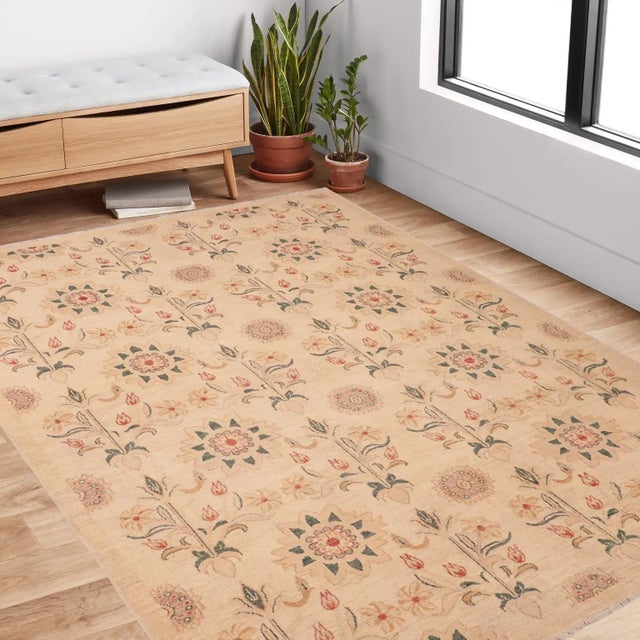 "Enhance the ambiance of your home with this magnificent Persian-influenced Turkish hand-knotted rug made by skilled...