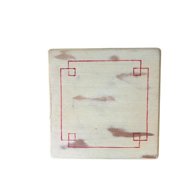 This elegant vintage European style side table is finished in a soft distressed cream and features hand-painted red bow...