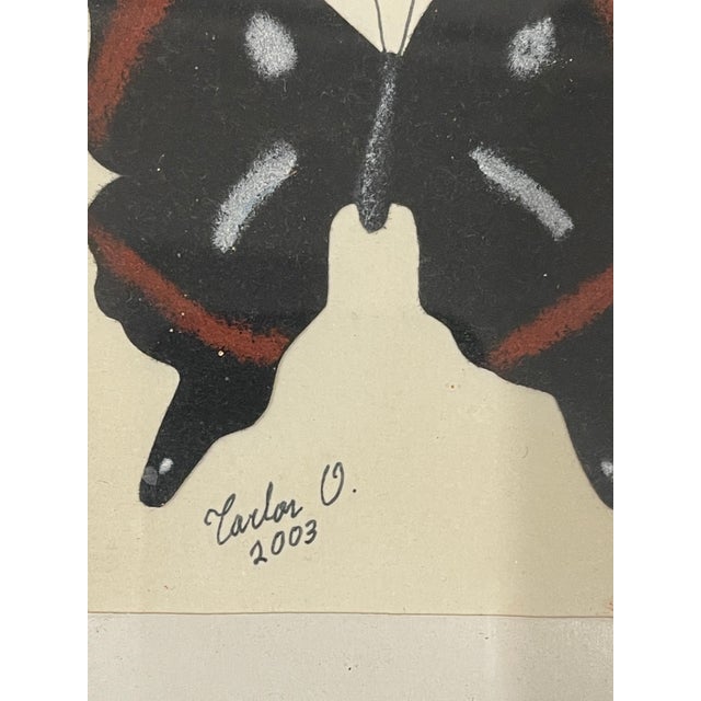 Vintage artisan butterfly painting on paper, signed and dated, O.Carloz. The in a bronzed ornate frame.