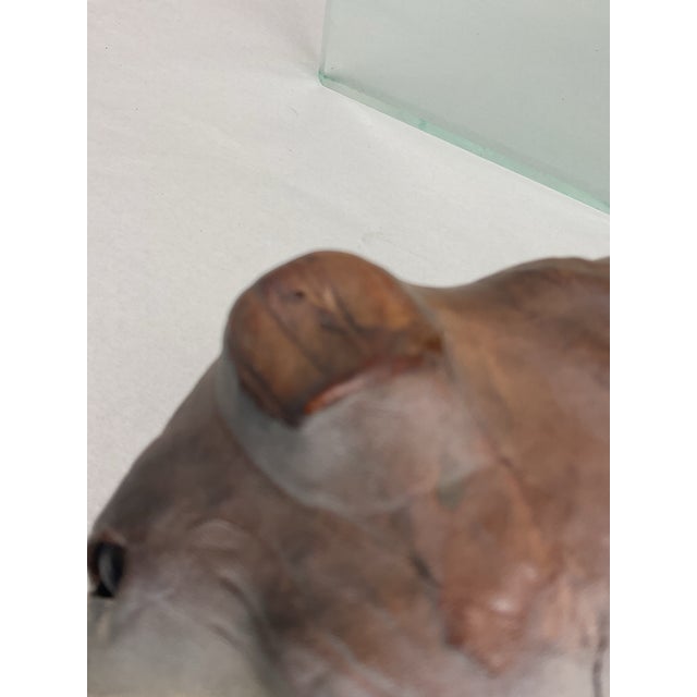 Leather clad bulldog figure. 2 of 2. Nice brown coloration with whitish face and legs/feet. Glass eyes