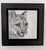 This artwork portrays a detailed rendering of a cougar's face, capturing its intense gaze and subtle expressions through...
