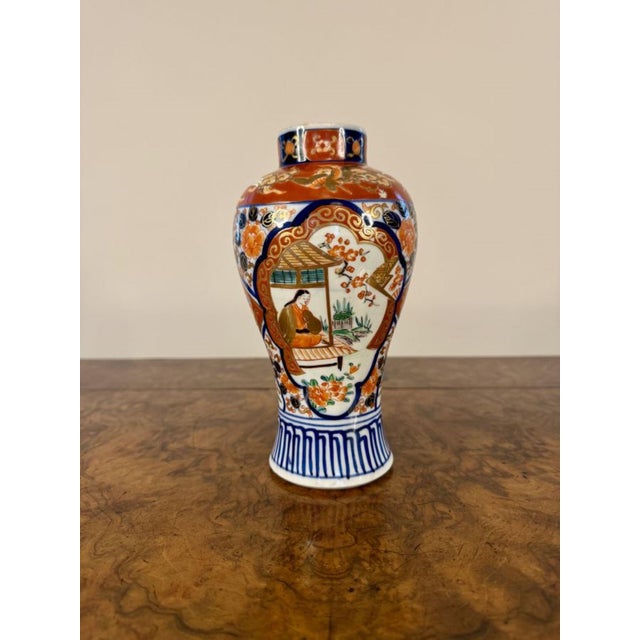 Quality pair of antique Japanese Imari baluster vases, having a quality pair of antique Japanese imari vases having...